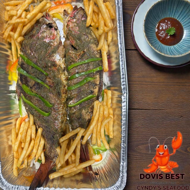 Grilled Red Snapper with Fried Plantains, French Fries or Jollof Rice.