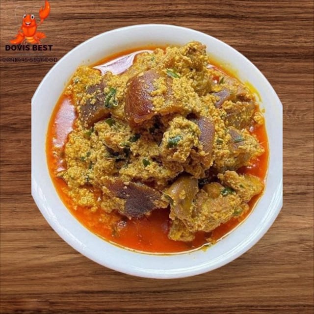 Egusi Soup with Yam Fufu or Garri or Corn Fufu or Rice.