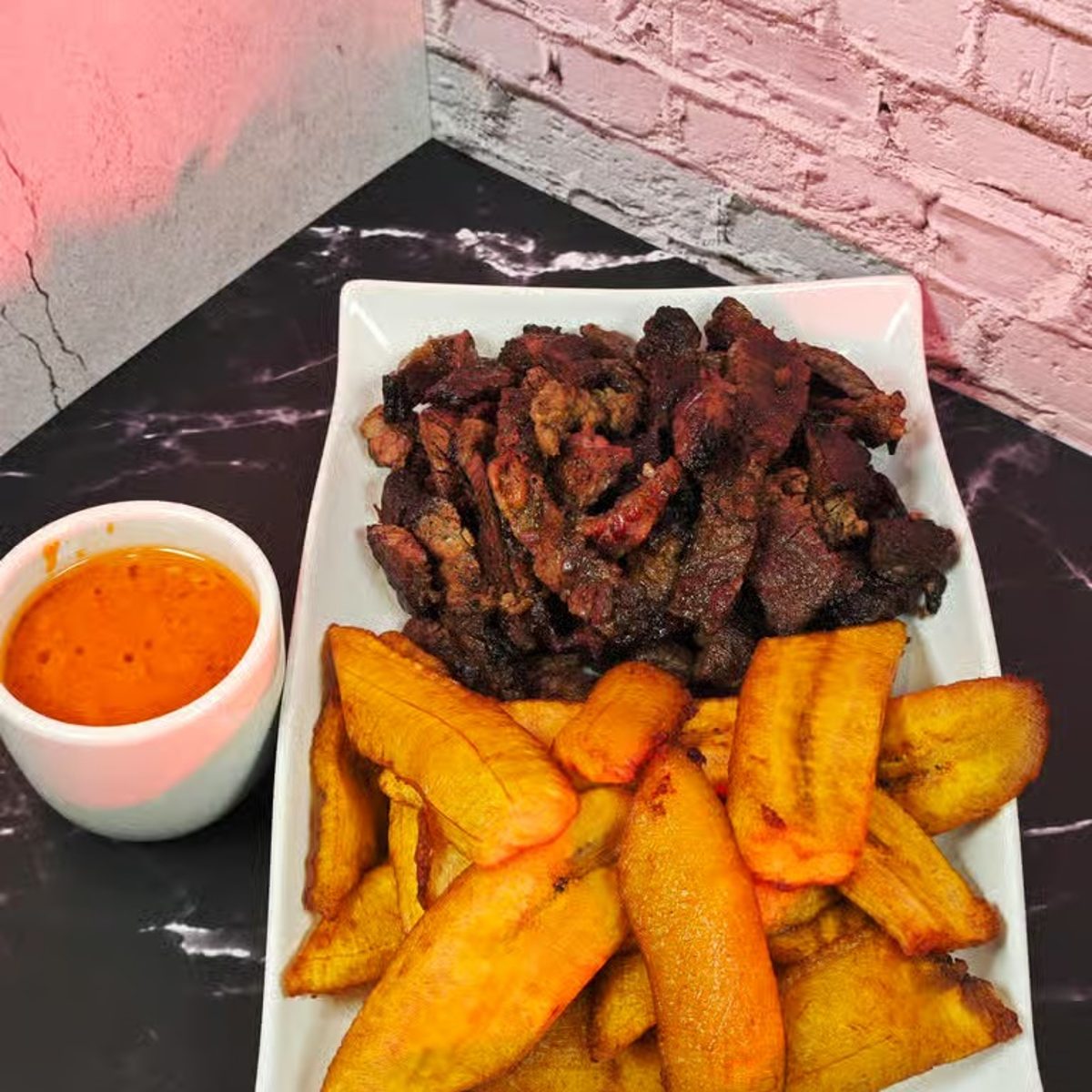 Suya-Grilled Beef with Fried Plantains and Hot Sauce