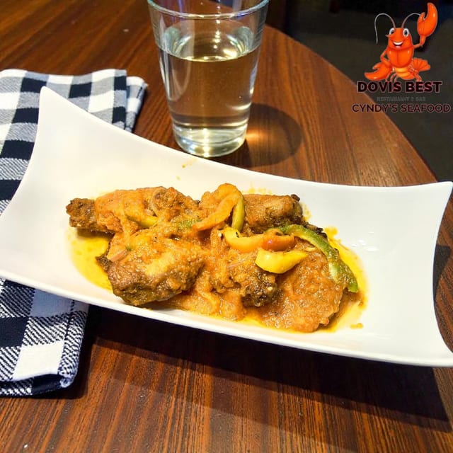 Curry Chicken, White Rice or Plantain.