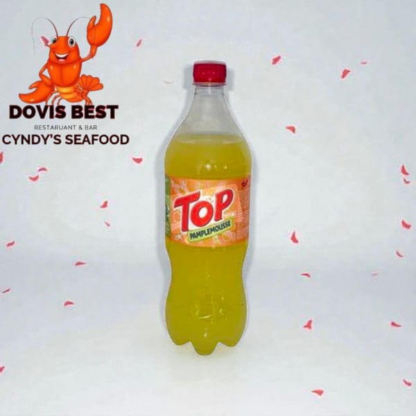 A bottle of Top Pamplemousse soda stands on a white surface with red confetti, next to the Cyndy's Seafood logo.