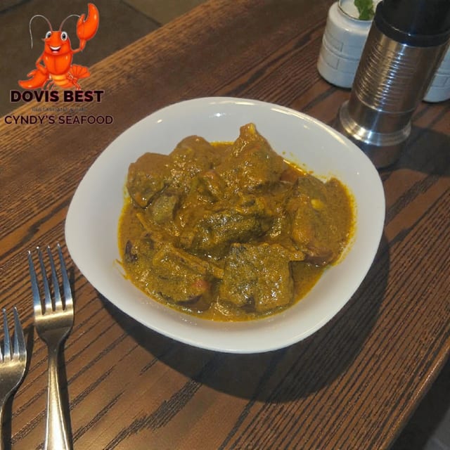 Curry Goat, White Rice or Plantain.